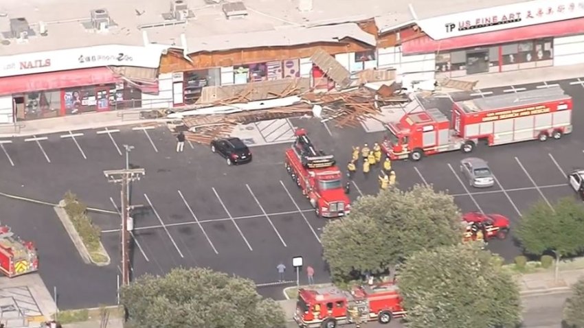 Fire crews rescue people in a partially collapsed strip mall in Temple City on Wednesday, May 25, 2022.