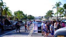 Spectators take in the sight of numerous classic cars in Escondido on an unspecified date.