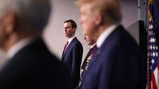 Jared Kushner stands in the press briefing room