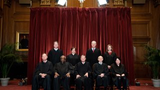 Seated from left: Associate Justice Samuel Alito, Associate Justice Clarence Thomas, Chief Justice John Roberts, Associate Justice Stephen Breyer and Associate Justice Sonia Sotomayor, standing from left: Associate Justice Brett Kavanaugh, Associate Justice Elena Kagan, Associate Justice Neil Gorsuch and Associate Justice Amy Coney Barrett pose during a group photo of the Justices at the Supreme Court in Washington, DC