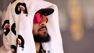 Fernando Tatis Jr. of the San Diego Padres looks on from the dugout during the sixth inning of a game against the Chicago Cubs at Petco Park on May 11, 2022, in San Diego.