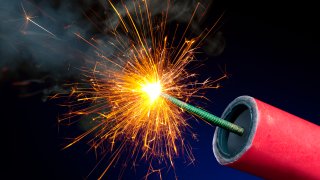 Fireworks or Explosives With Sparkling Lit Fuse