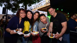 Guests of the Taste of Little Italy sample bites from Shake Shack in this undated photo courtesy of the Little Italy Association.