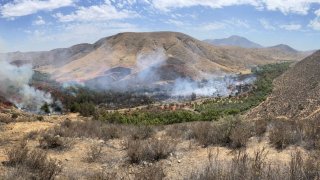 Cal Fire San Diego released a photo showing charred land near Dulzura from a brush fire dubbed the Border 16.