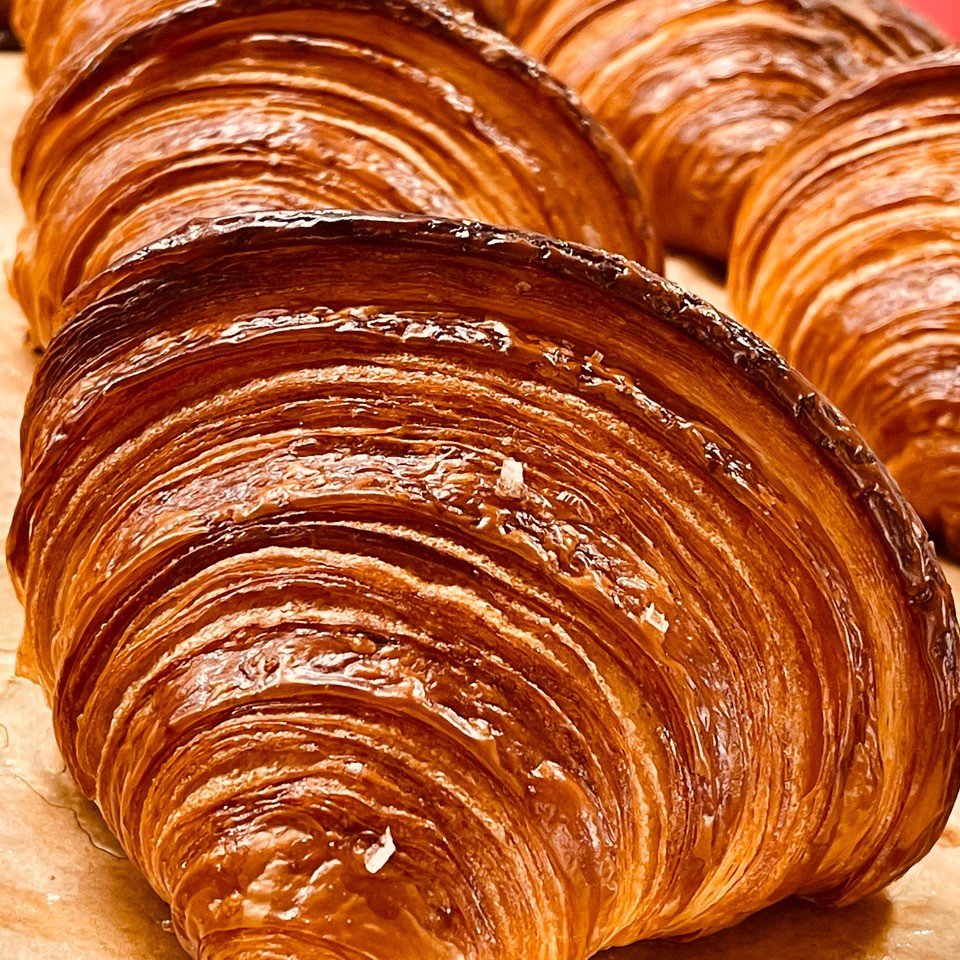 A classic Izola croissant with 96 thin layers.