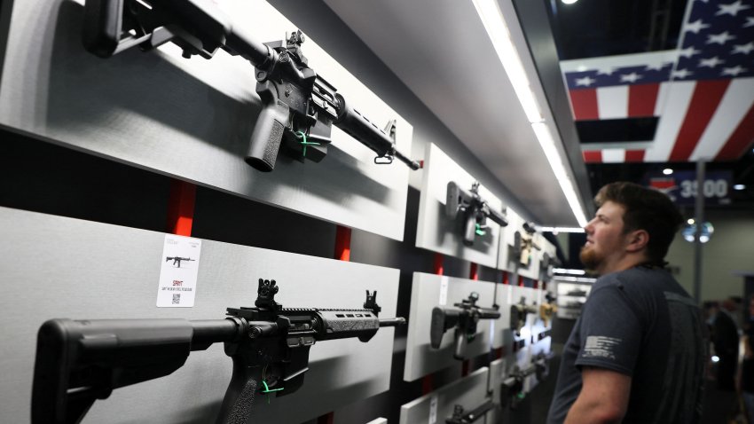 A man looks at Saint brand rifles during the National Rifle Association (NRA) annual convention in Houston, Texas, U.S. May 27, 2022. 