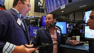 Traders work on the floor of the New York Stock Exchange (NYSE) in New York City, U.S., July 19, 2022.