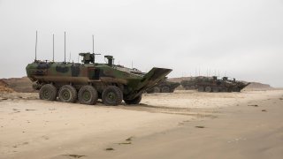 FILE. An Amphibious Combat Vehicle (ACV) with the 3d Assault Amphibian Battalion, 1st Marine Division, sits on the beach of Camp Pendleton, July 11.