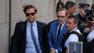 Actor Kevin Spacey, center, arrives at the Old Bailey, in London