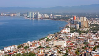 Aerial view over Puerto Vallarta, Mexican beach resort city situated on the Pacific Ocean's Bah’a de Banderas, Jalisco, Mexico.