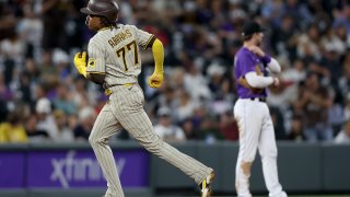 DENVER, COLORADO – JULY 11: C.J. Abrams #77 of the San Diego Padres circles the bases after hitting a three RBI home run against the Colorado Rockies in the eighth inning at Coors Field on July 11, 2022 in Denver, Colorado. (Photo by Matthew Stockman/Getty Images)