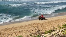 A lifeguard patrols the North Shore in Oahu, Hawai’i in this undated image. (Courtesy: “Big Wave Guardians”/Marty Hoffman Films in association with MacGillivray Freeman Films