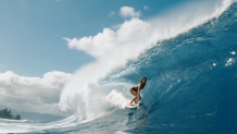 A surfer rides a breaking wave on the North Shore in O’ahu, Hawai’i in this undated image. (Courtesy: Marty Hoffman Films in association with MacGillivray Freeman Films)