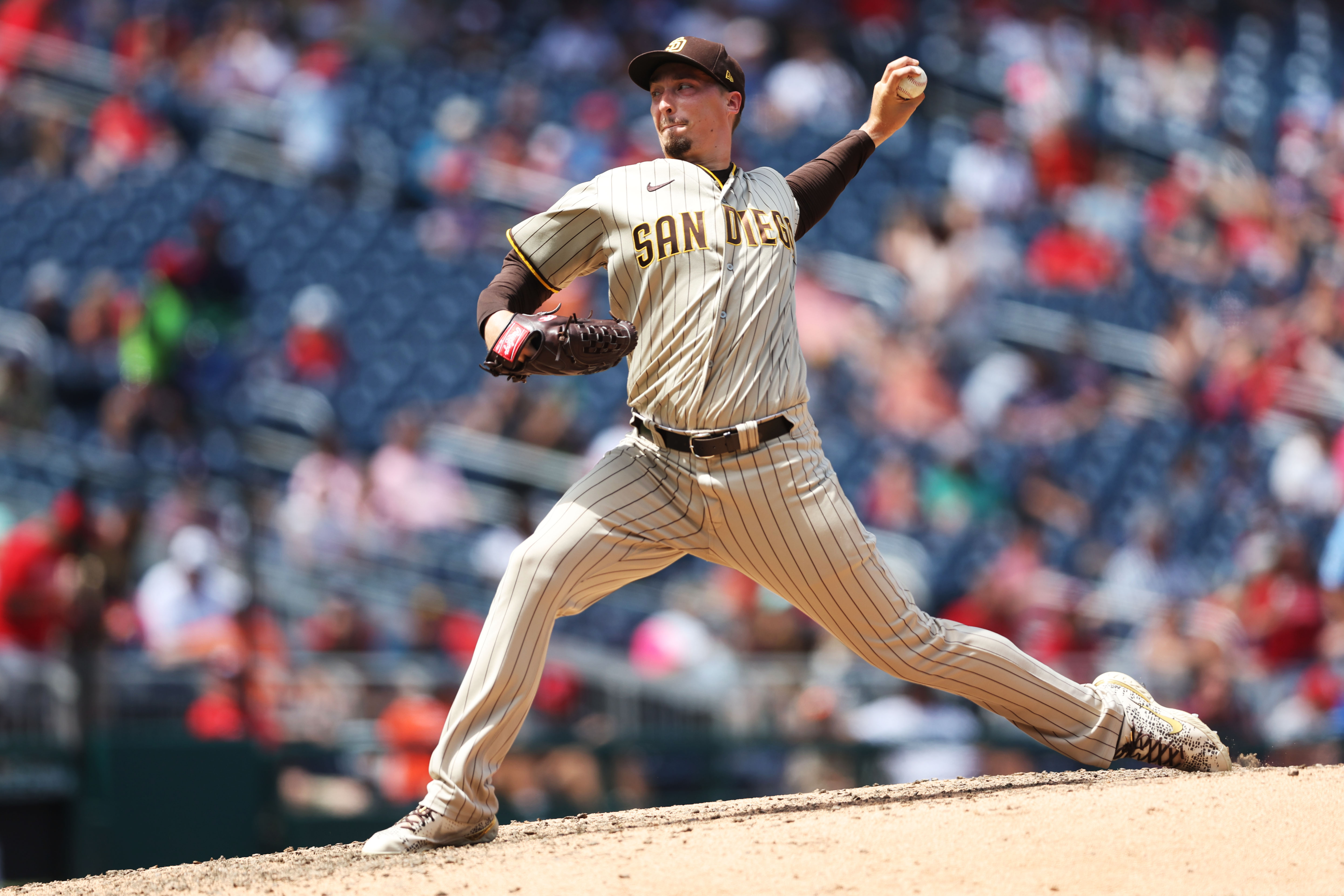 ST. LOUIS, MO - AUGUST 28: San Diego Padres starting pitcher Blake Snell  (4) stays limber as he watches the game from the dugout during a MLB game  between the San Diego