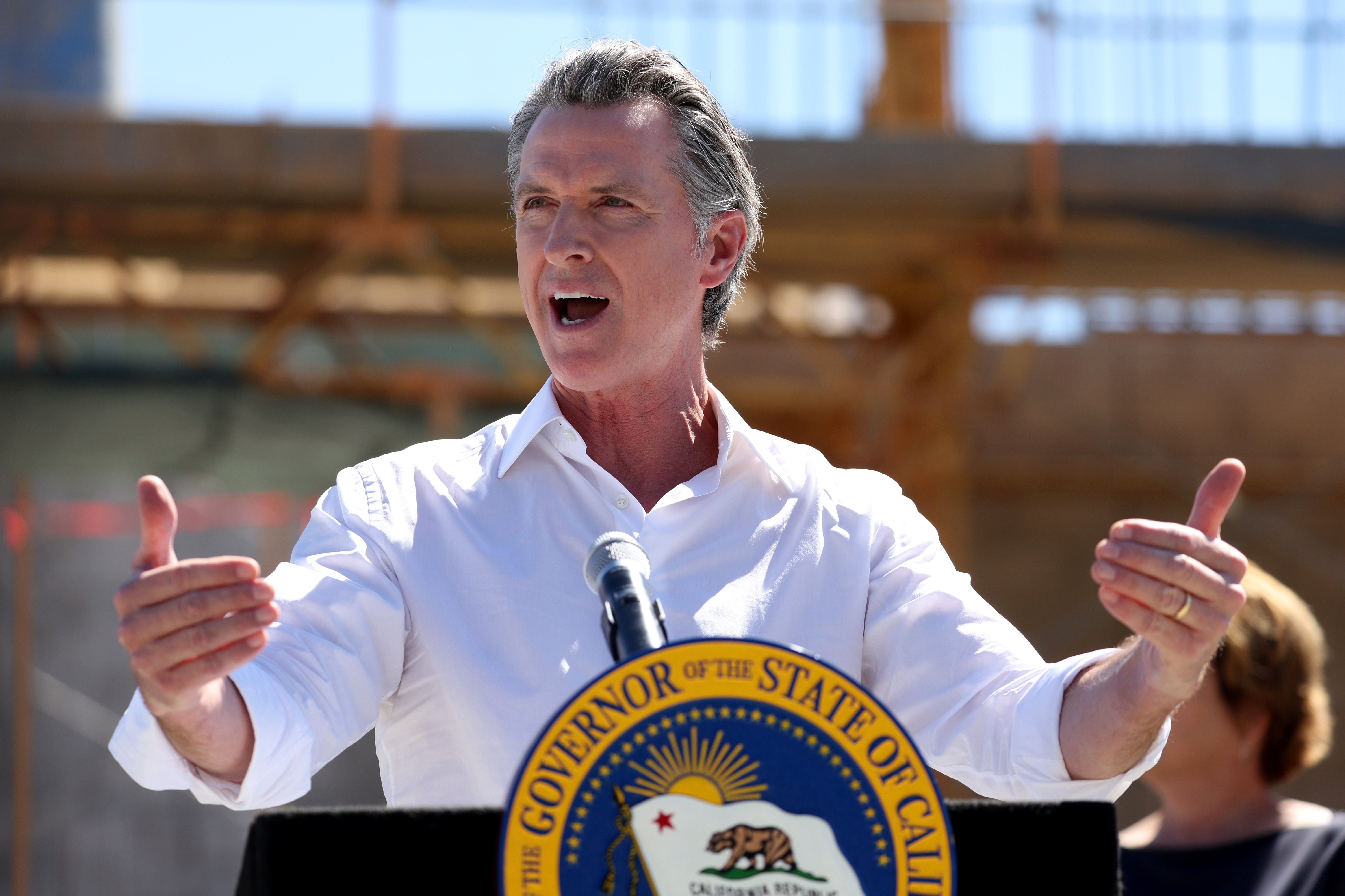 California Gov. Gavin Newsom speaks to reporters.