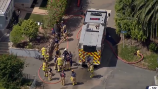 Firefighters investigating a house fire in Del Mar on Aug. 12, 2022.