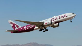 MALAGA COSTA DEL SOL AIRPORT, MALAGA, SPAIN – 2022/08/21: A Qatar Airways Boeing 777-200LR in special livery 2022 Qatar football world cup, climbing out Malaga Costa del Sol airport.
Qatar Airways is the state-owned flag carrier airline of Qatar headquartered in Doha. (Photo by Fabrizio Gandolfo/SOPA Images/LightRocket via Getty Images)