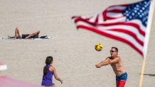 Huntington Beach, CA - September 04: People play volleyball in the sand while joining thousands of beach-goers flocking to the beach to escape the heat wave on Labor Day weekend in Huntington Beach on Sunday, Sept. 4, 2022. (Allen J. Schaben / Los Angeles Times via Getty Images)