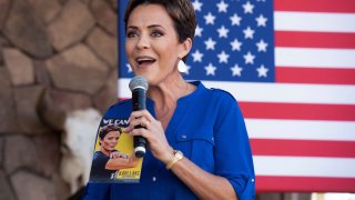 Arizona republican candidate for governor Kari Lake greets the audience during a stop on the Truth and Courage PAC’s Take Back America Bus Tour with U.S. Senator Ted Cruz (R-TX), ahead of the midterm elections, at San Tan Flat in Queen Creek, Arizona, U.S., October 5, 2022.