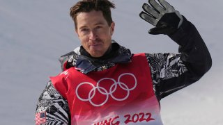 Shaun White waves after competing in the men's halfpipe finals at the 2022 Winter Olympics, Friday, Feb. 11, 2022, in Zhangjiakou, China.