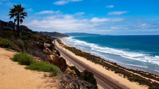 Looking down the coastline toward Torrey Pines State Beach in San Diego, California.