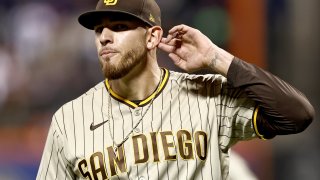 Joe Musgrove of the San Diego Padres gestures to his ear as he walks back to the dugout after closing out the sixth inning against the New York Mets in Game 3 of the National League Wild Card Series at Citi Field on Oct. 09, 2022 in the Flushing neighborhood of the Queens borough of New York City.