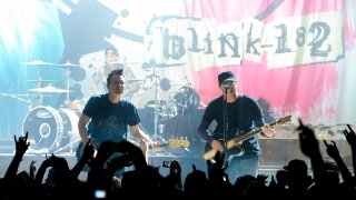 HOLLYWOOD, CA - NOVEMBER 06: (L-R) Travis Barker, Mark Hoppus and Tom DeLonge of blink - 182 perform at Hollywood Palladium on November 6, 2013 in Hollywood, California. (Photo by Noel Vasquez/Getty Images)