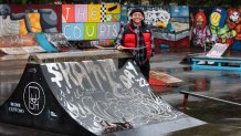 Sara Campos poses at tennis courts being converted to a skatepark