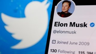 Elon Musk account on Twitter displayed on a phone screen and Twitter logo displayed on a laptop screen are seen in this illustration photo taken in Krakow, Poland on November 14, 2022. (Photo by Jakub Porzycki/NurPhoto via Getty Images)