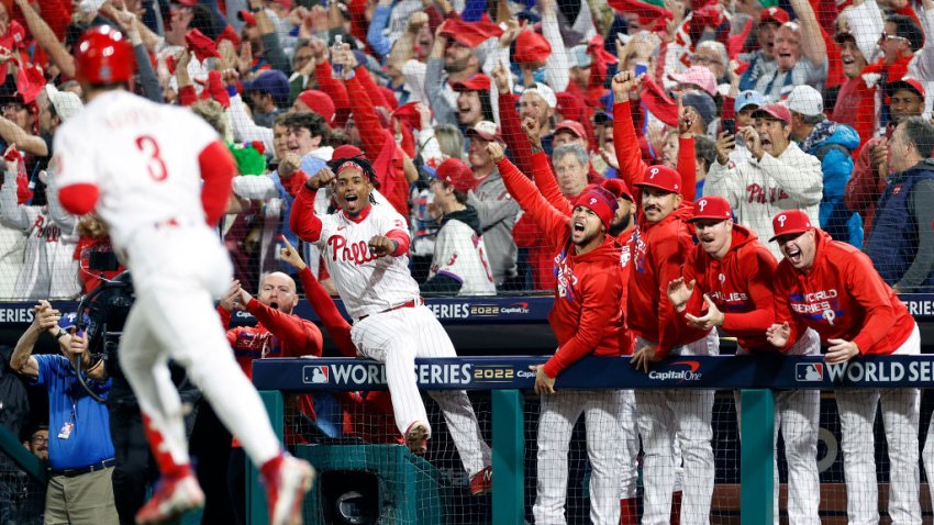 PHILADELPHIA, PENNSYLVANIA – NOVEMBER 01: The Philadelphia Phillies dugout reacts after Bryce Harper #3 of the Philadelphia Phillies hits a two-run home run against the Houston Astros during the first inning in Game Three of the 2022 World Series at Citizens Bank Park on November 01, 2022 in Philadelphia, Pennsylvania. (Photo by Sarah Stier/Getty Images)