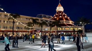Californians coming in droves to a skating rink at the Hotel Del Coronado, which is illuminated with Xmas lights.