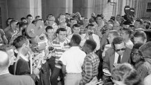 Defiant white students at Arkansas' North Little Rock High School block the doors of the school, denying access to six African-American students enrolled in the school Sept. 9, 1957. Moments later the African American students were shoved down a flight of stairs and onto the sidewalk, where city police broke up the altercation.