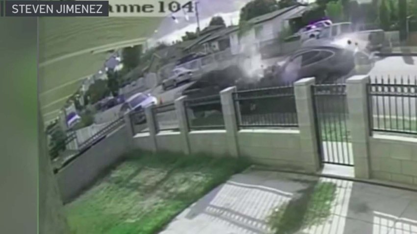 Security footage captured an intense crash on camera Thursday after a man was shot, then drove his car at a high rate of speed down the street and slammed into a parked pickup truck.