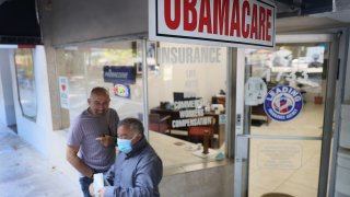 An Obamacare sign is seen outside of the Leading Insurance Agency, which offers plans under the Affordable Care Act (also known as Obamacare) on January 28, 2021 in Miami, Florida.