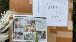 A sign with pictures of David D'Lima posted at the site of his death in a hit-and-run crash on New Year's Eve in Encinitas.