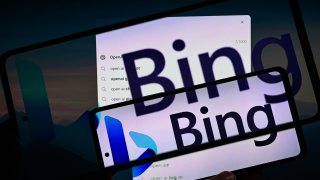 Microsoft Bing OpenAI seen in double exposure displayed on screen and mobile.