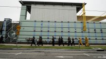 SANTA MONICA, CA - JUNE 07:  Santa Monica Police officers prepare to search the campus of Santa Monica College after multiple shootings were reported on the campus June 7, 2013 in Santa Monica, California. Six people were killed in the rampage, according to news reports. (Photo by Kevork Djansezian/Getty Images)