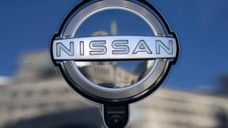 FILE - A Nissan logo is seen on a car at its showroom in Tokyo, Feb. 21, 2023.