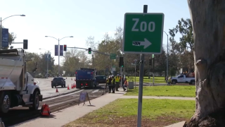 Construction crews work to renovate Park Boulevard near Zoo Drive.