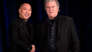 Former White House Chief Strategist Steve Bannon greets fugitive Chinese billionaire Guo Wengui before introducing him at a news conference on November 20, 2018 in New York.