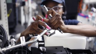 A worker assembles components at an auto part facility in Charleston, South Carolina, U.S., on March 20, 2018.