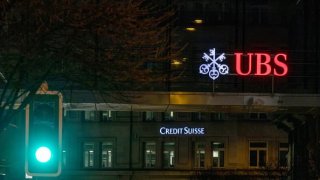 The logos of Swiss banks Credit Suisse and UBS on March 16, 2023 in Zurich, Switzerland.