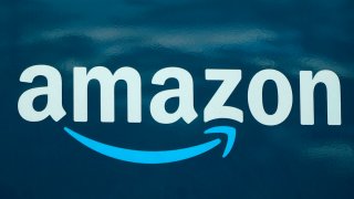 FILE – An Amazon logo appears on a delivery van, Oct. 1, 2020, in Boston. Amazon plans to eliminate 9,000 more jobs in the next few weeks, the company’s CEO Andy Jassy said in a memo to staff on Monday, March 20, 2023. The job cuts would mark the second largest round of layoffs in the company’s history, adding to the 18,000 employees the company said it would lay off in January. (AP Photo/Steven Senne, File)