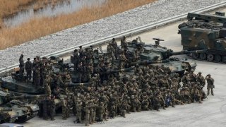 U.S. and South Korean, top, army soldiers gather before a combined live fire exercise between South Korea and the United States at Rodriguez Live Fire Complex in Pocheon, South Korea, Wednesday, March 22, 2023. (AP Photo/Ahn Young-joon)