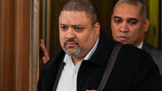 Manhattan District Attorney Alvin Bragg exits a building, Wednesday, March 22, 2023, in New York.
