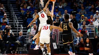 ORLANDO, FLORIDA – MARCH 16: Keshad Johnson #0 of the San Diego State Aztecs blocks Dalton Bolon #3 of the Charleston Cougars during the second half in the first round of the NCAA Men’s Basketball Tournament at Amway Center on March 16, 2023 in Orlando, Florida. (Photo by Kevin Sabitus/Getty Images)