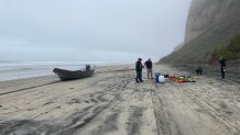 Investigators at the scene where a panga boat capsized in Black's Beach, La Jolla on March 12, 2023.