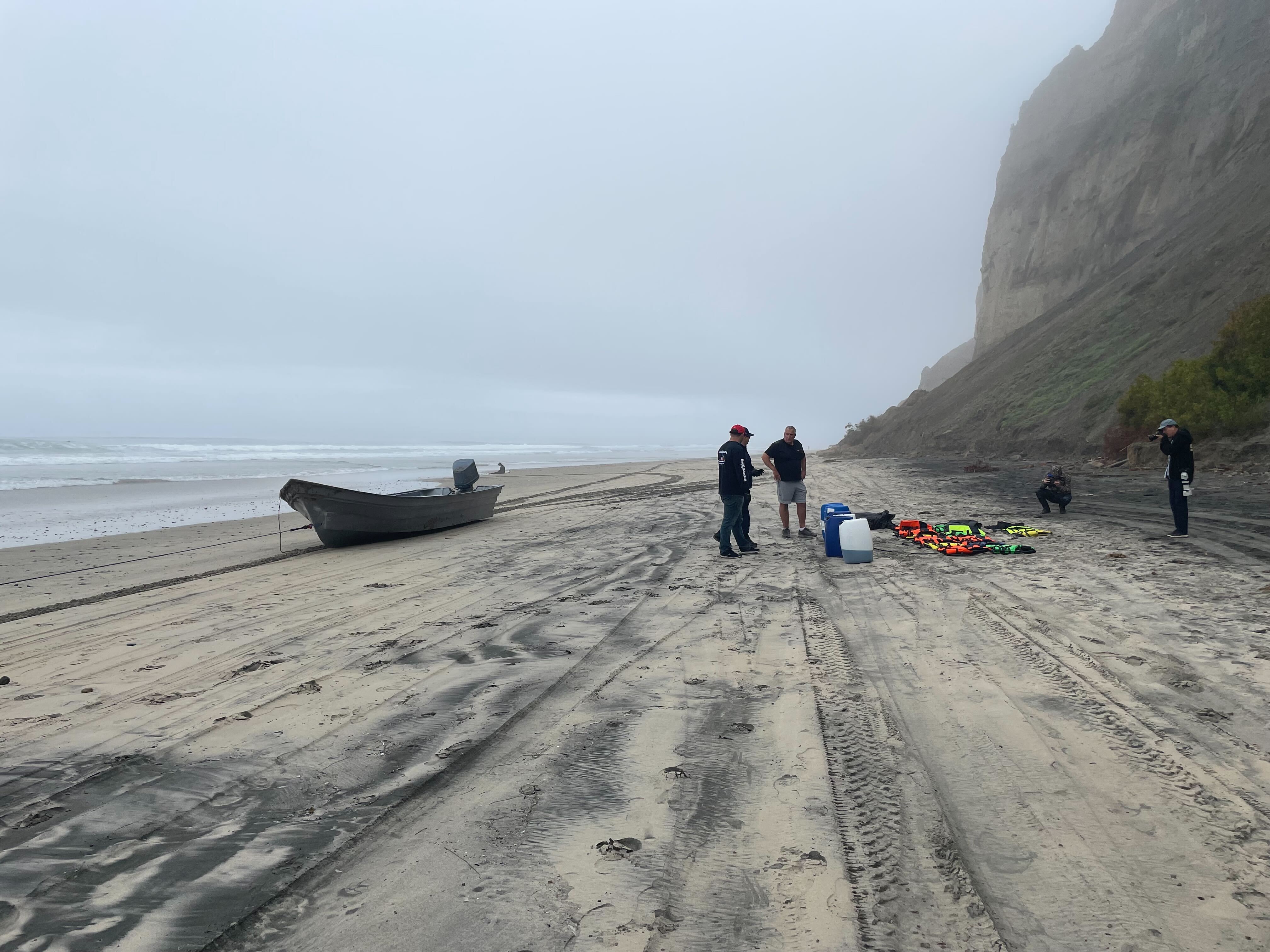 Investigators at the scene where a panga boat capsized in Black's Beach, La Jolla on March 12, 2023.