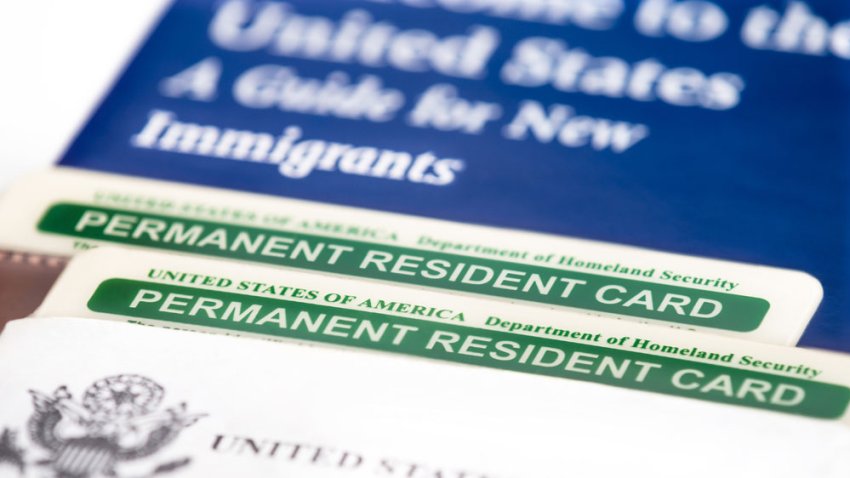 United States of America permanent resident cards, green card. Immigration concept. Closeup with shallow depth of field.
