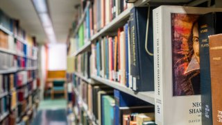 Books line the shelves at the Rice University Library on April 26, 2022 in Houston, Texas.